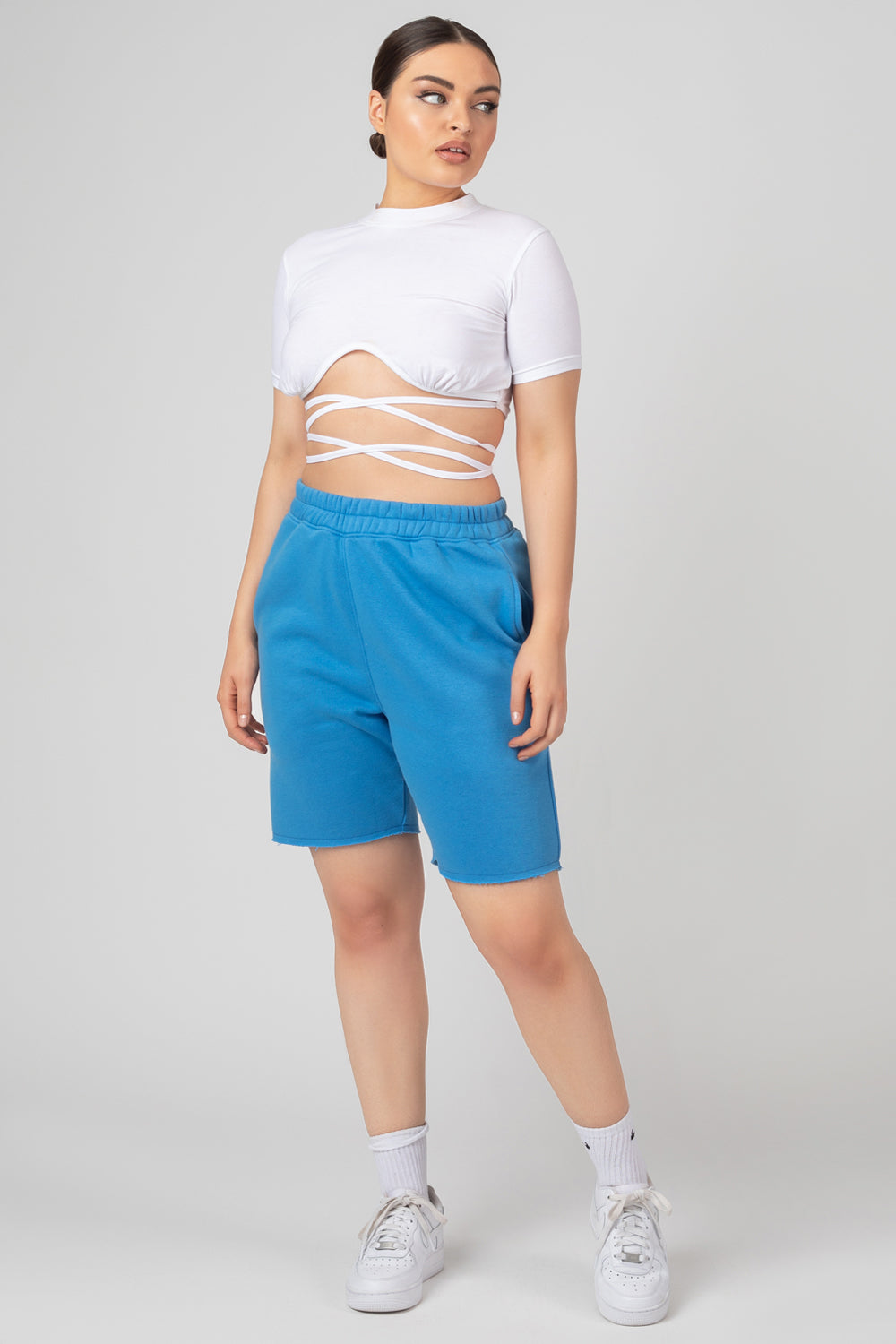 Image of LONGLINE RAW HEM SHORTS BLUE