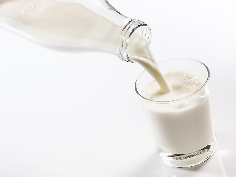 Milk being poured into a glass