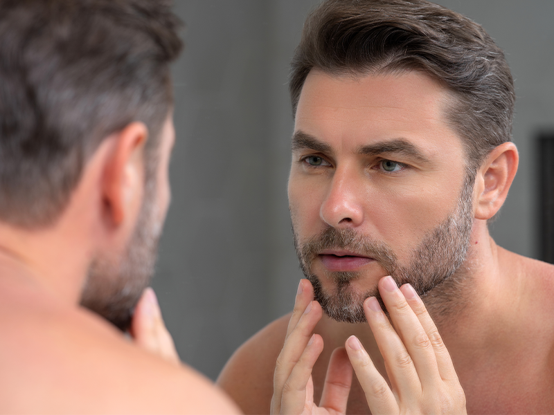 Man with healthy skin from taking creatine powder