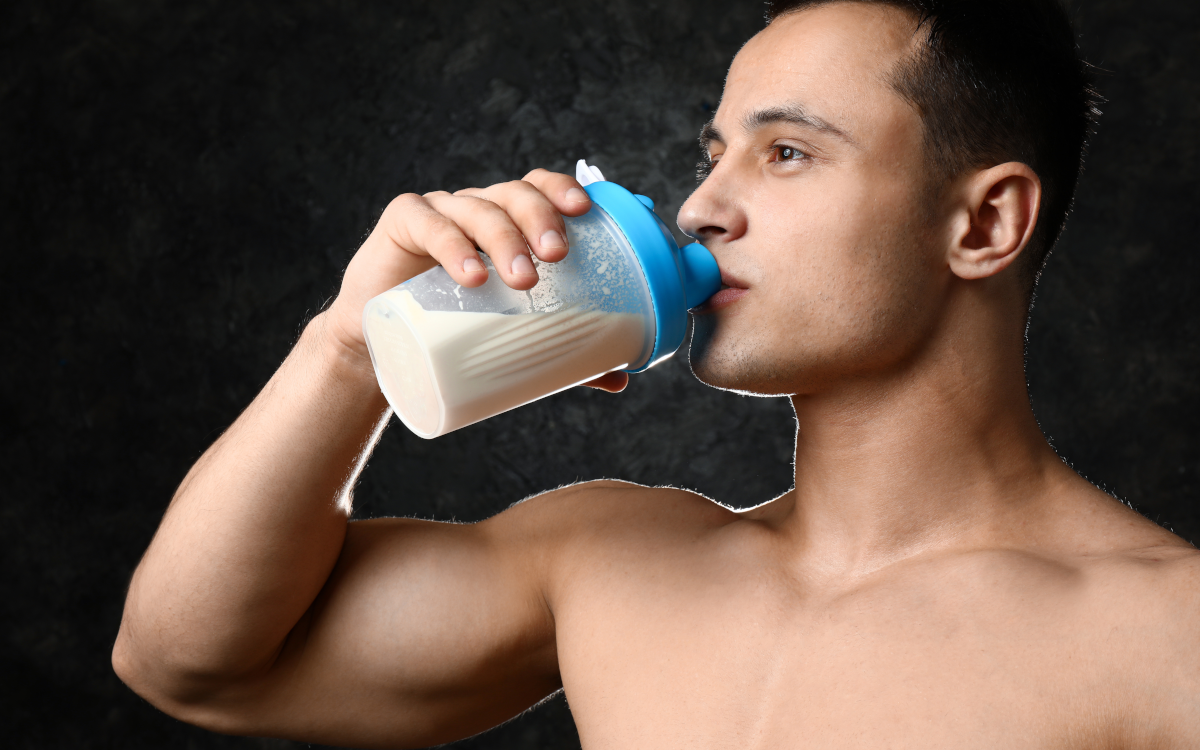 person taking a mass gainer supplement