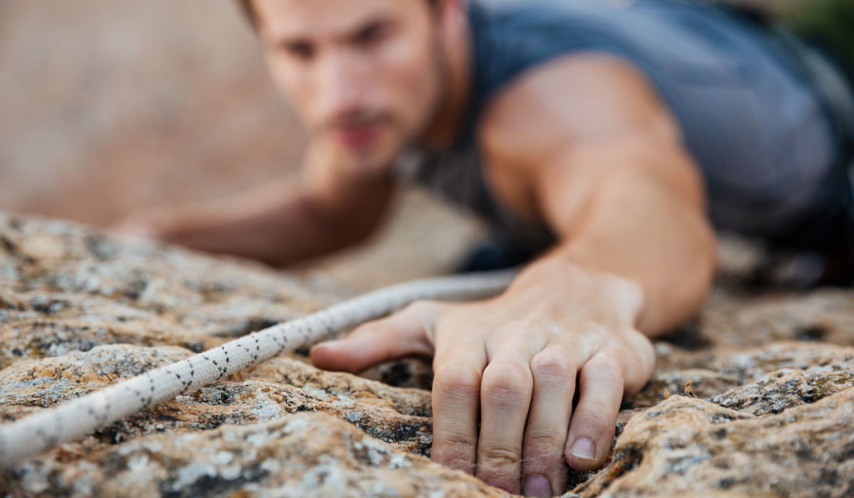 man rock climbing