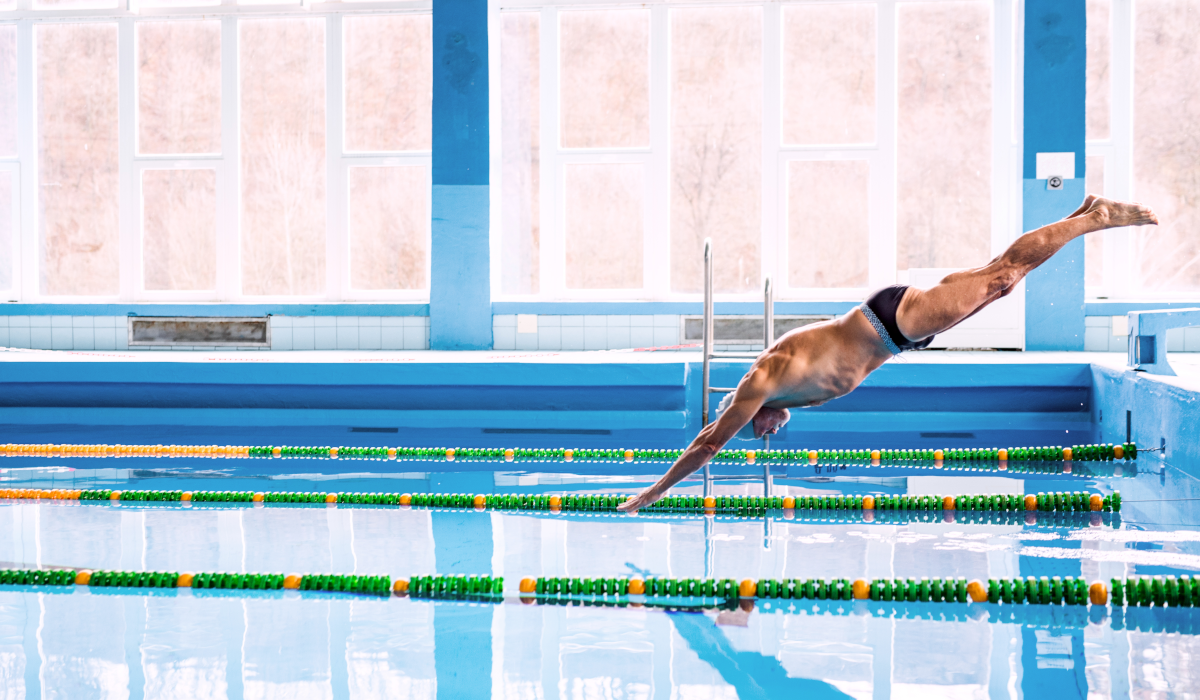 Man diving into swimming pool