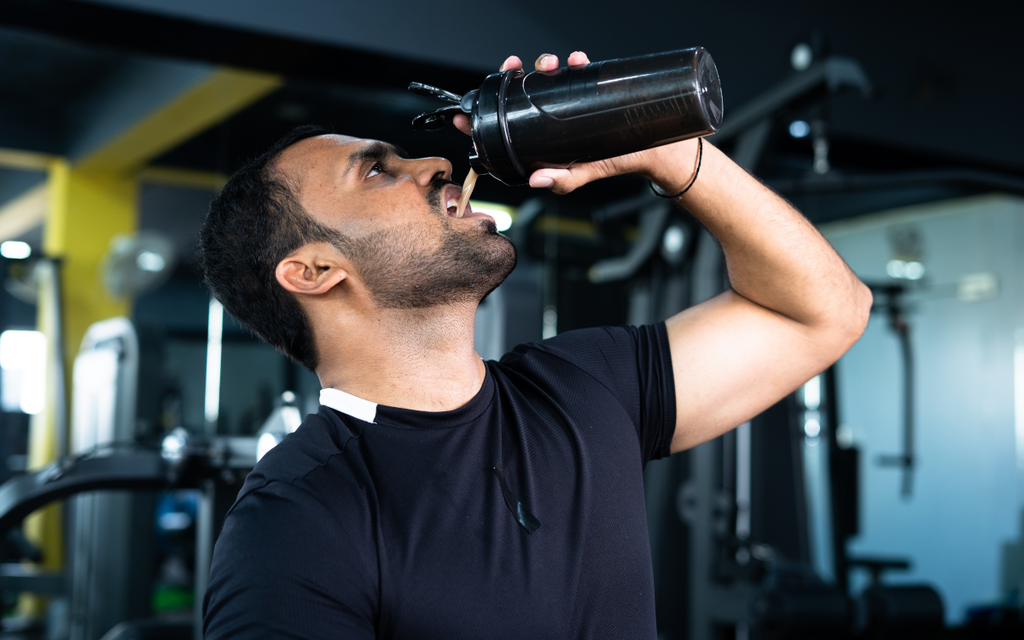 Man drinking pre-workout