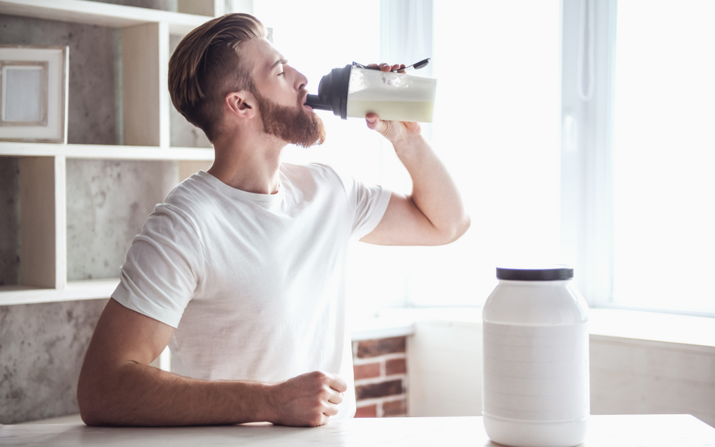 Man drinking mass gainer