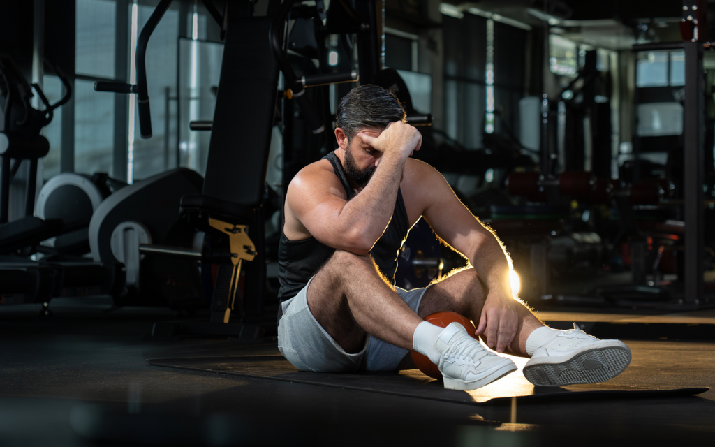 Tired man after gym session