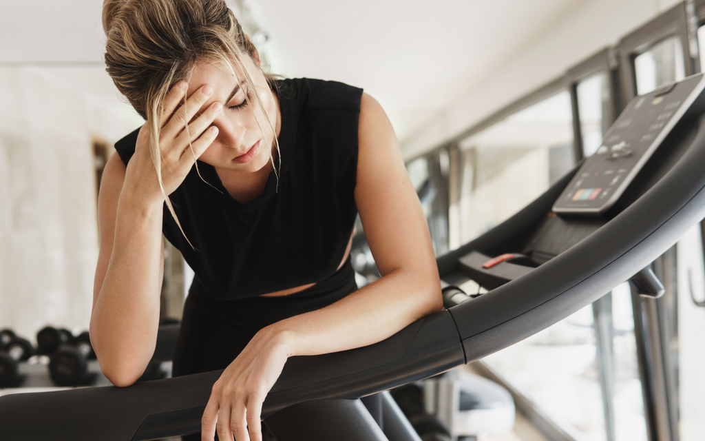 Tired woman in the gym