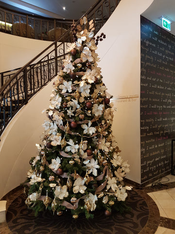 christmas tree by star case in foyer