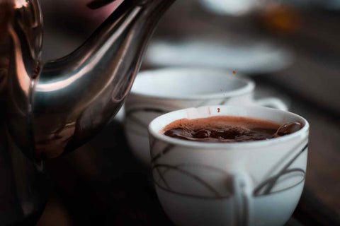 Brewing ground coffee in a cup