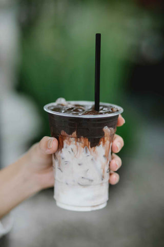 cup of cold brew with dark roast beans