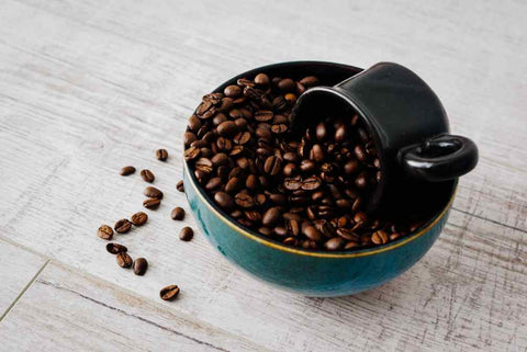 Dark roast coffee beans with low acidity