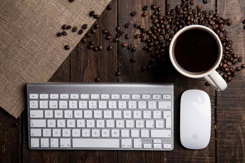 Medium roast coffee caffeine content with computer keyboard
