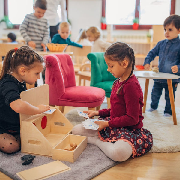 Developmentally Appropriate Practice (DAP) being used in the classroom as a child-led play-based learning technique. Two girls customizing play to meet their learning needs.