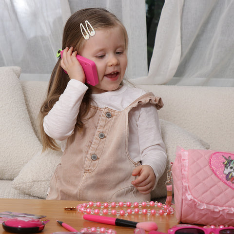 Girl play with pretend makeup toy