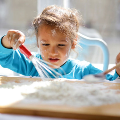 Girl play with flour