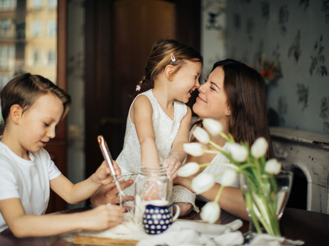 Parent with kids playing