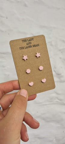 Baby Pink, laser cut stud earrings in the shapes of hearts, hexagons and stars.