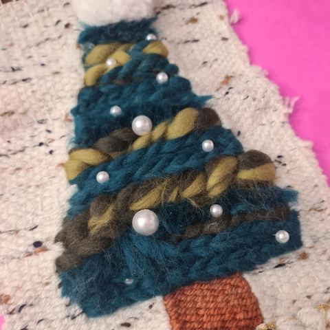 Image shows a woven, wool Christmas tree made in the Art Attack Angus studio