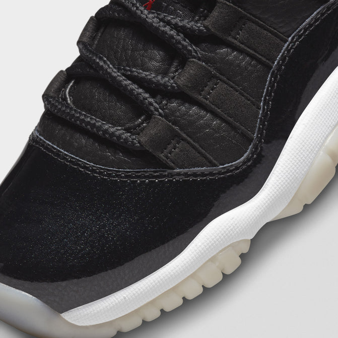 black red and white jordan 11 low top