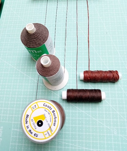 Photo showing hand sewing leather threads from Identity Leathercraft