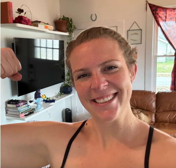 Woman shows her bicep muscles