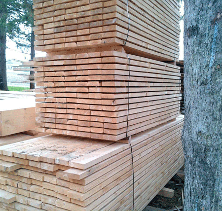 Stacked planks of Canadian White Cedar wood