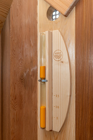 Wall mounted sand timer for inside sauna
