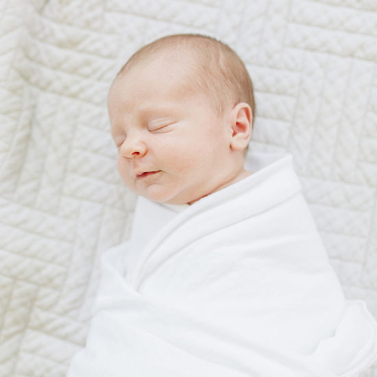 swaddled baby sleeping