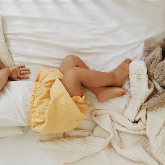 Toddler sleeping in bed