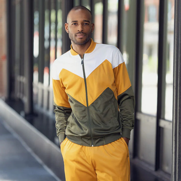 a man wearing a Montique's yellow, olive and white tracksuit.