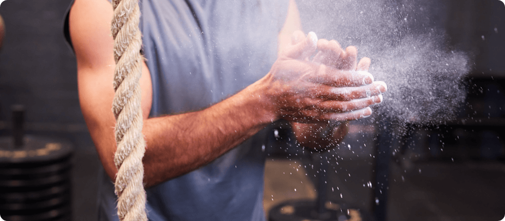 man clapping hands with chalk