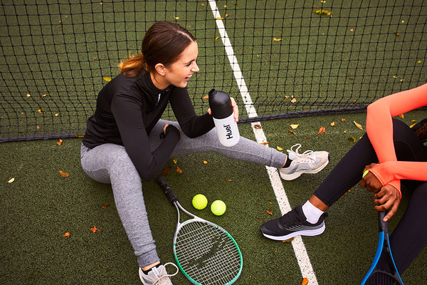 Women playing tennis with Huel