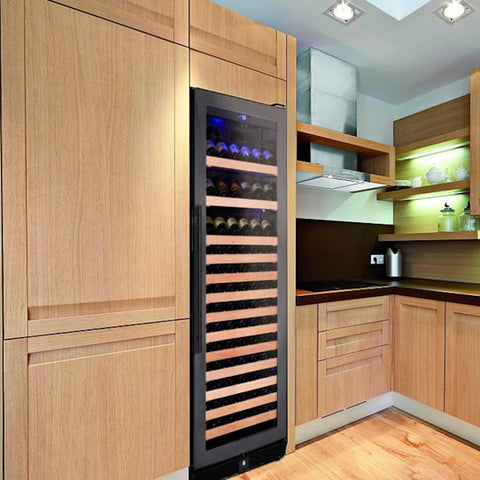 A borderless black glass door right hand hinge single zone wine cooler with wooden shelves set in a built-in cabinetry