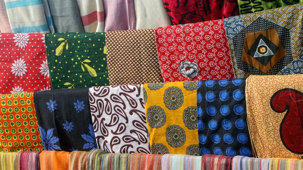 A variety of fabrics for a person to choose from. 