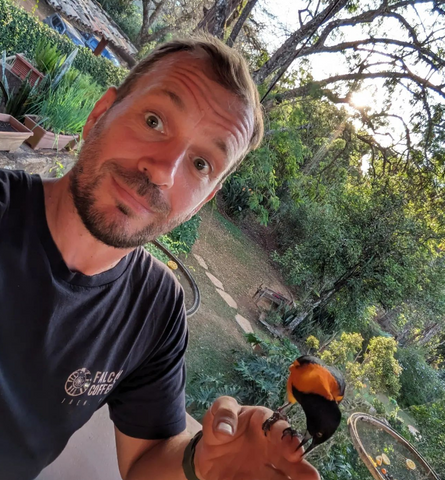 David Beattie with a bird rescued by the Wings Project in Brazil