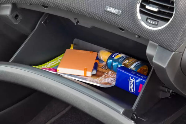 car Glove Compartment filled with maps and tools
