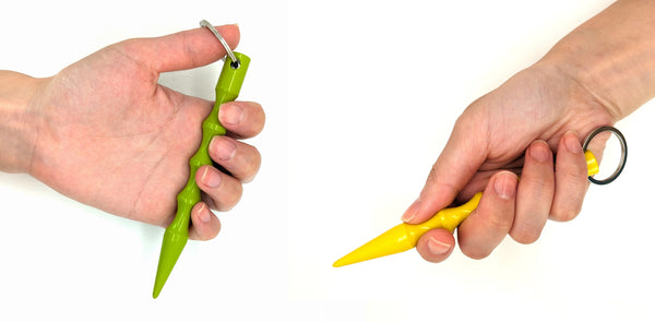 Two hands holding lime green and yellow kubaton in icepick and forward grip