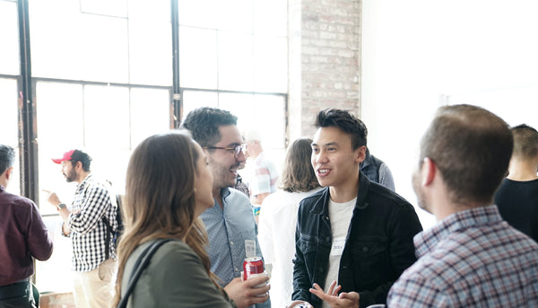 College Students Socializing at an Event