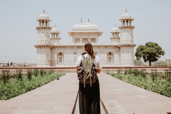 Woman Looking at Mosque Temple Building with Backpack