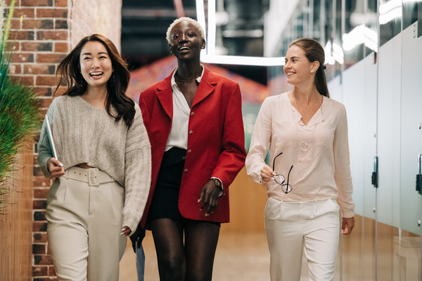 3 Diverse Women Walking Confidently At Work