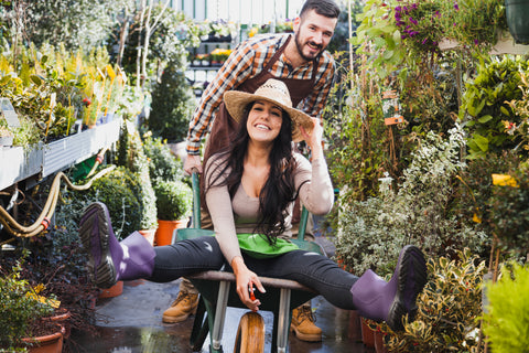 Joyful couple at a garden center shopping.