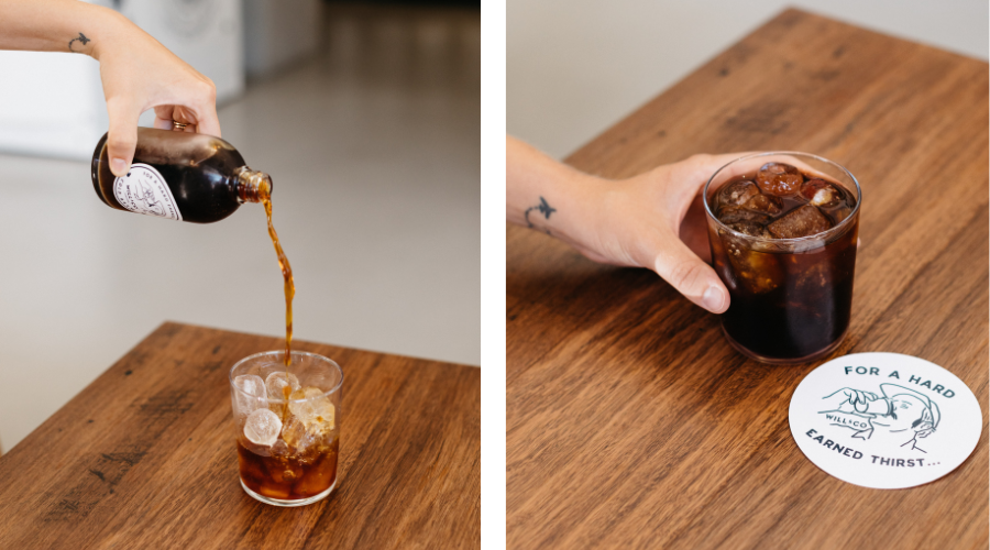 A barista pouring and displaying a glass of Will & Co cold brew coffee