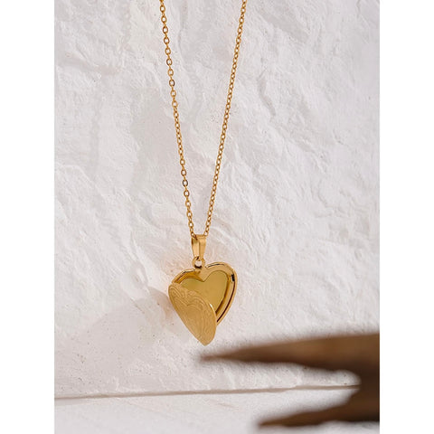 A beautiful golden heart-shaped locket necklace, perfect for women to wear and show their love