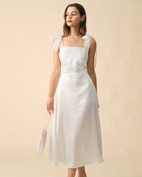 https://www.rihoas.com/collections/white-dresses/products/the-solid-color-tie-strap-maxi-dress