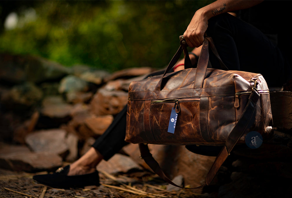 Man carrying a duffle bag from top handle