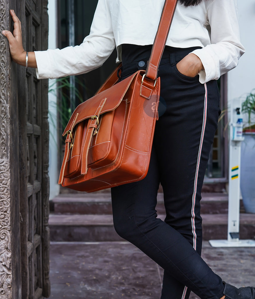 women wearing a orange messenger bag