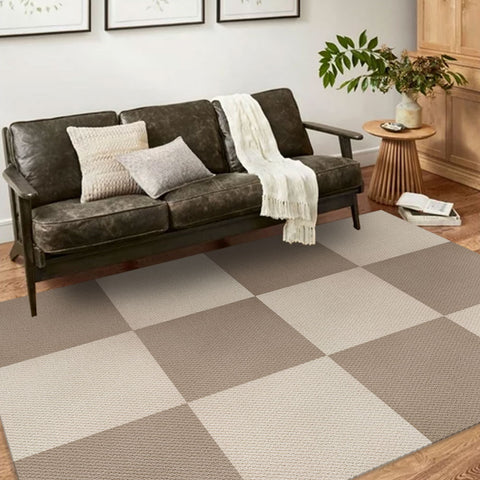 In a log-style living room, Matace brown and beige Berber carpet squares are laid out under sofas.