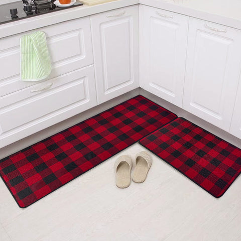 In a plain white Kitchen, a Matace farmhouse red-and-black checkered Kitchen Rug is laid on the ground.