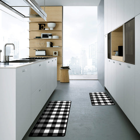 In an elegant, simple style Kitchen, the Matace black and white Gingham Kitchen Rug Set is laid out on the ground.