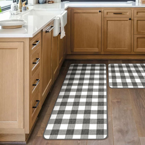 In one farmhouse, a Buffalo Plaid kitchen rug is spread over an L-shaped kitchen.