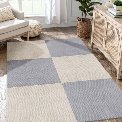 Matace carpet squares in gray and beige in a farmhouse style livingroom.